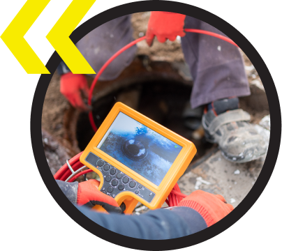 workers sing cameras to look into drain pipes for cleaning